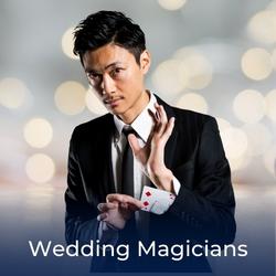 Magicain performing a magic trick at a wedding with a link to Wedding Magicians available to book on Entertainers Worldwide