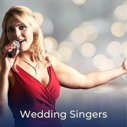 Female Singer singing into microphone with link to local Wedding Singers for Hire
